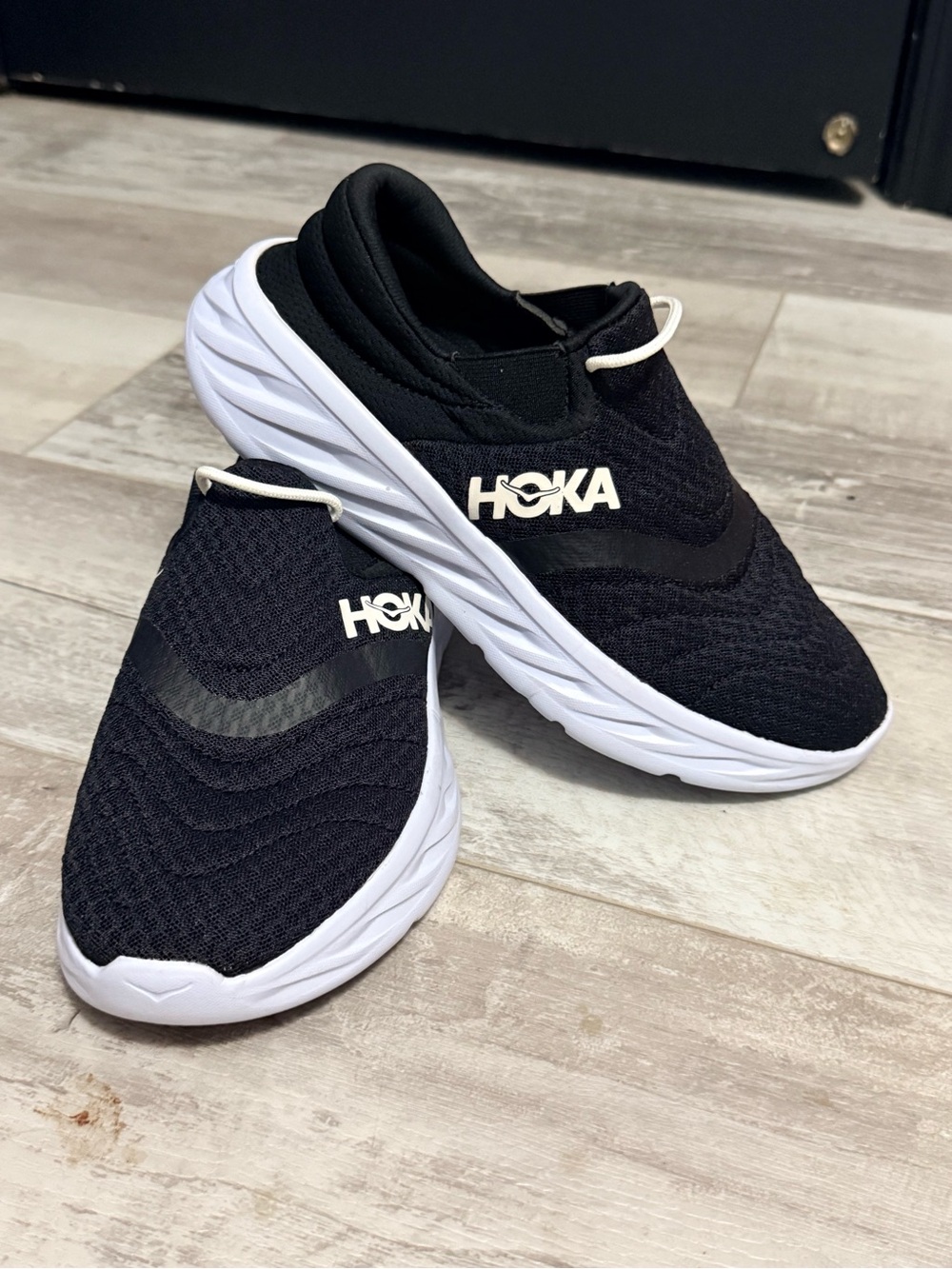 Hoka Kids Black and White Slip-On Cushioned Sneakers
